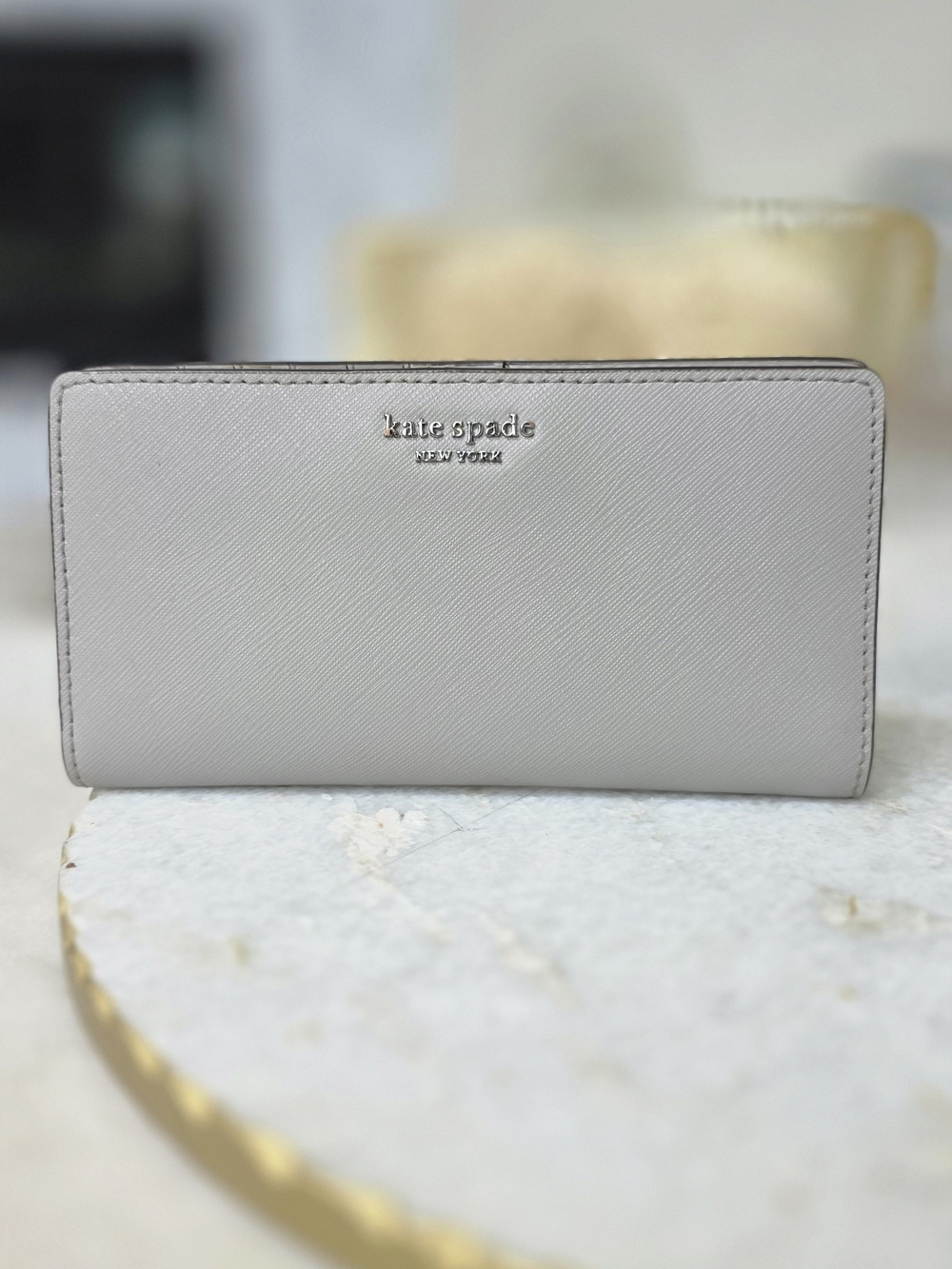 Kate Spade New York Gray Saffiano Large Slim Bifold Wallet Silver Logo
